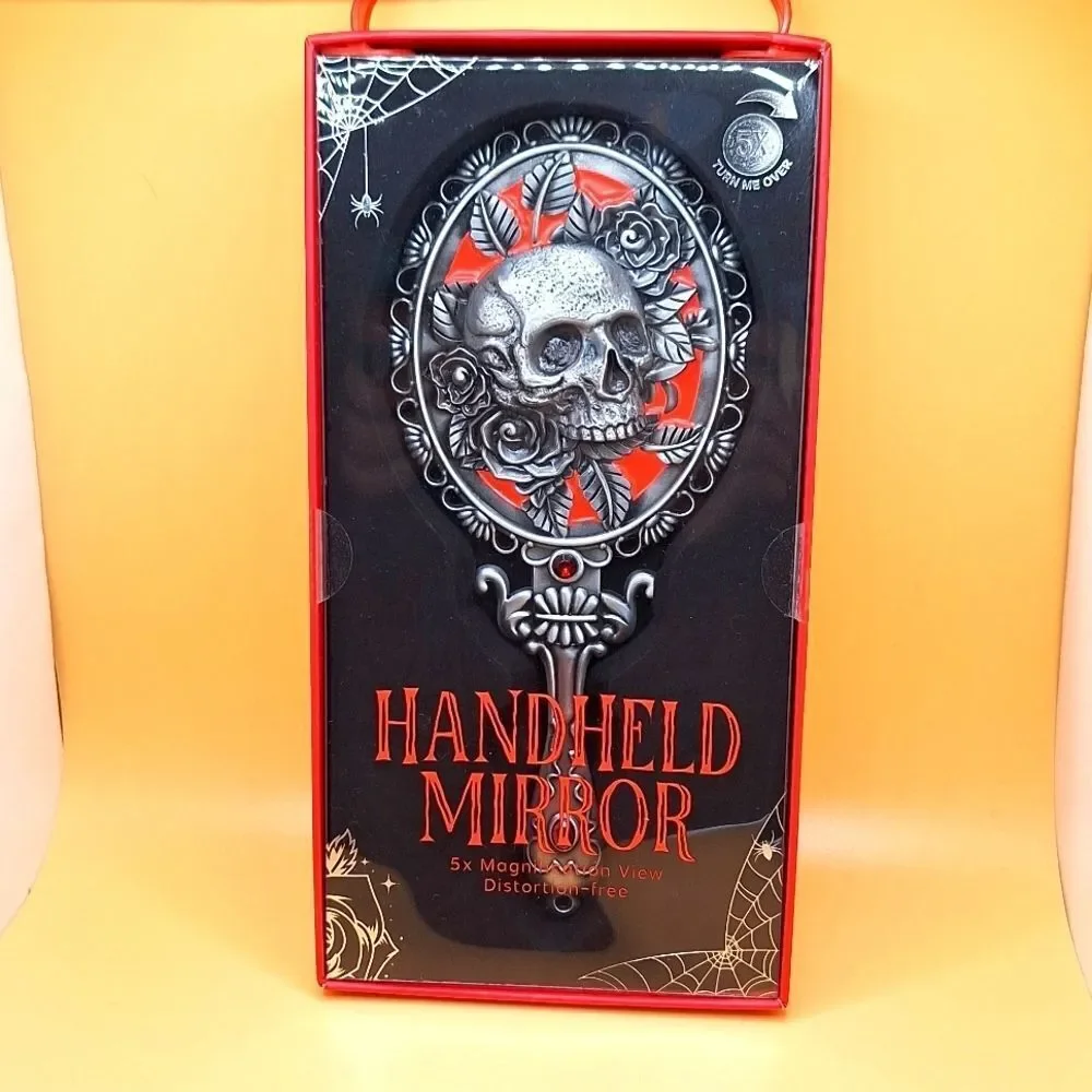 Skull magnifying handheld mirror